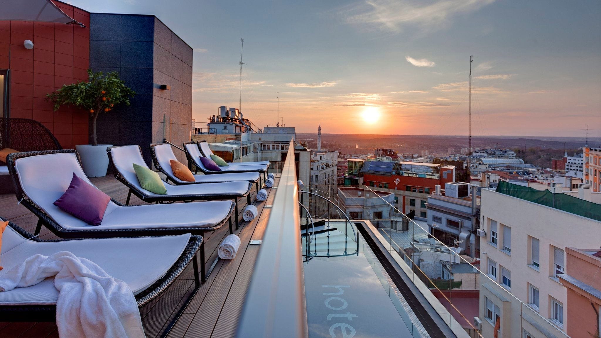 rooftop hotel pool with lounge chairs