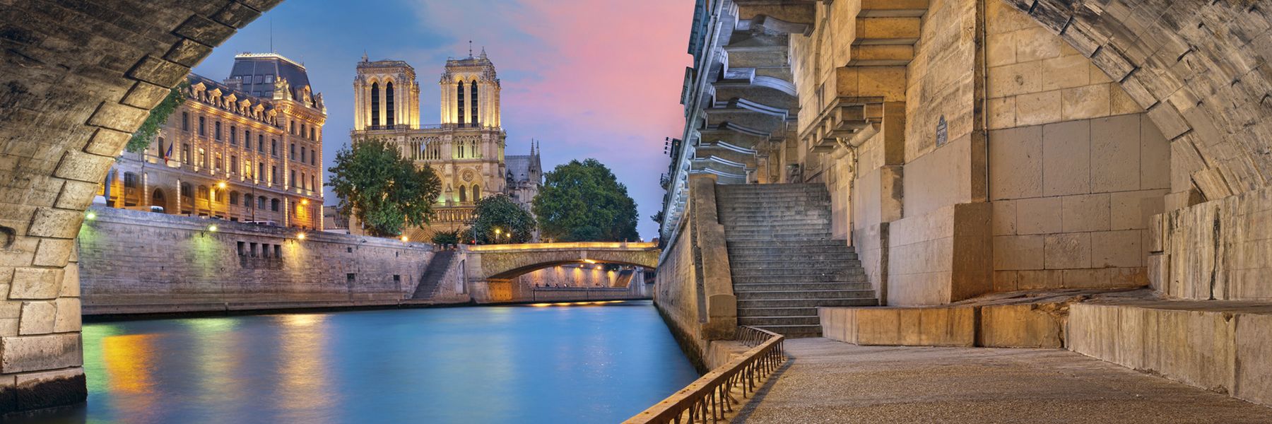 water with stairs and church in background