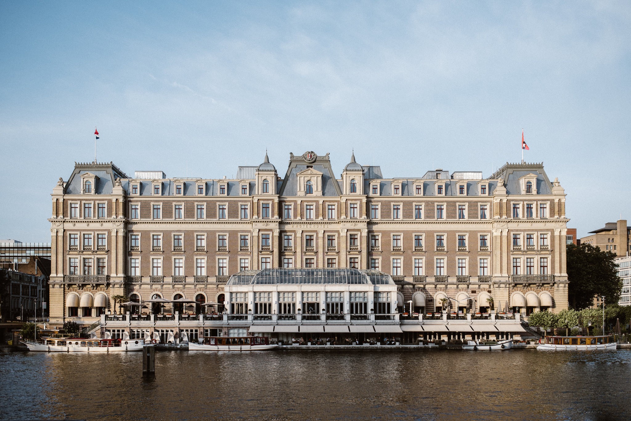 Long rectangle building on the water in Amsterdam.