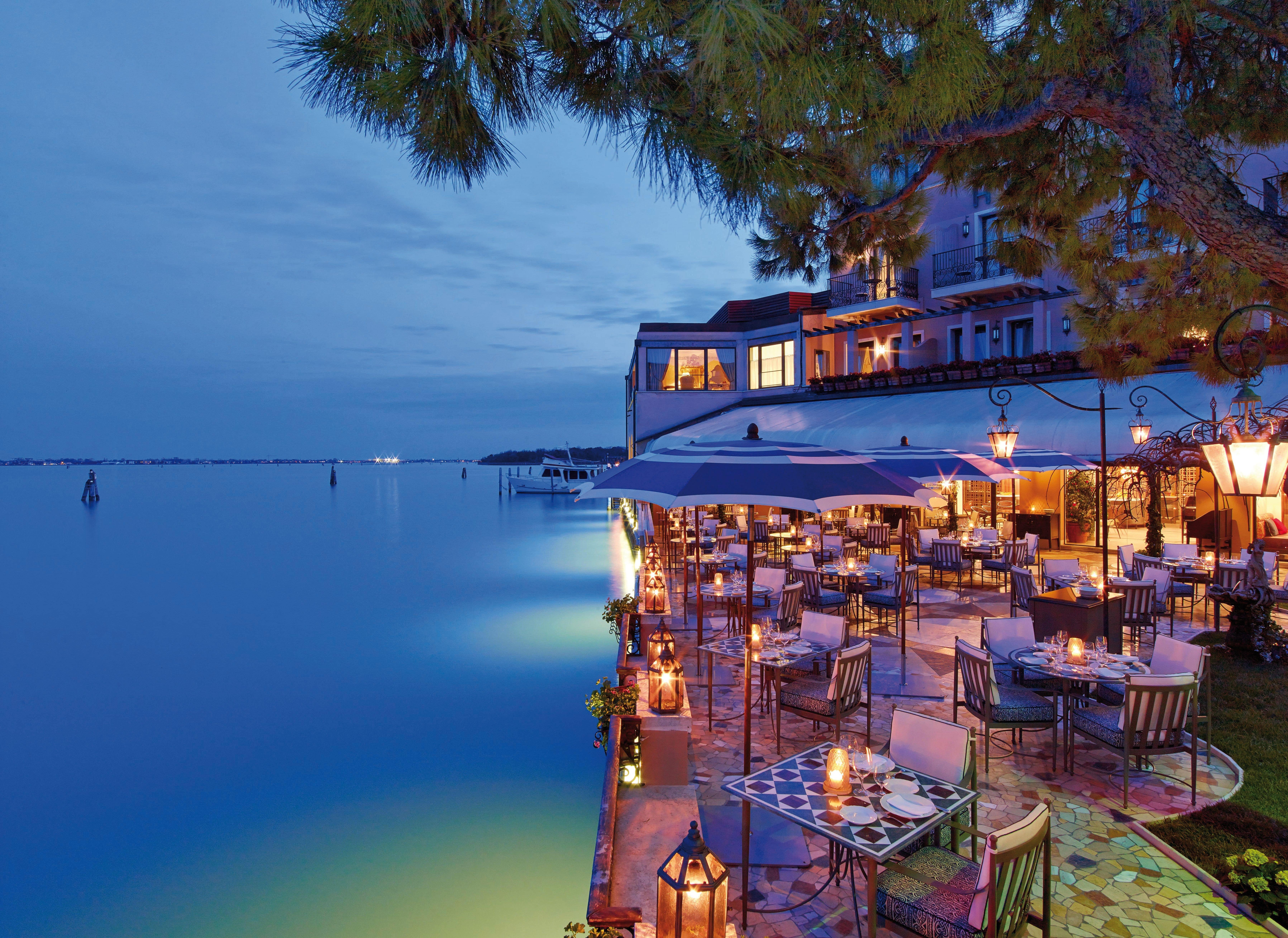 Evening picure of an outdoor restaurant on the water